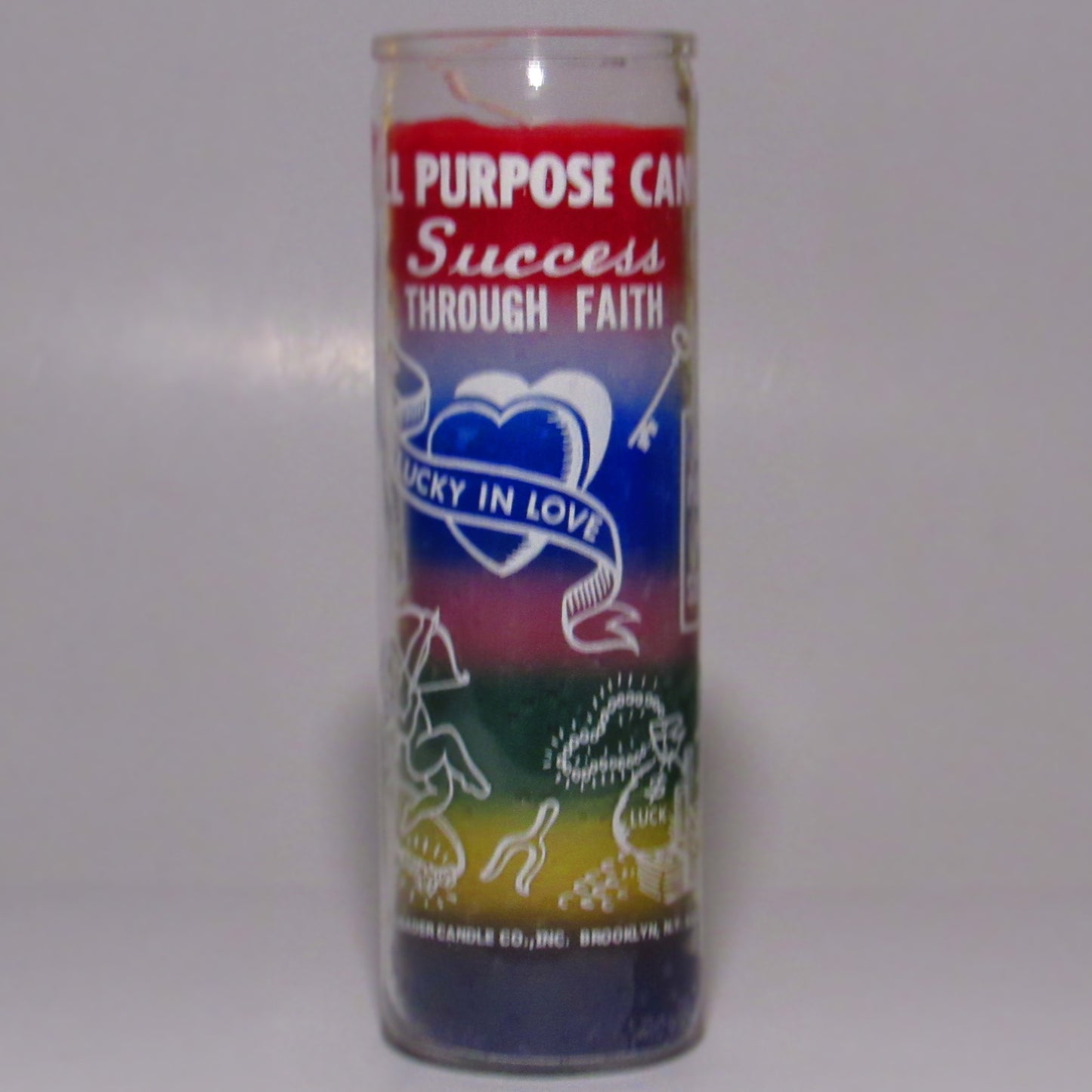 Decorative candle with text and symbols