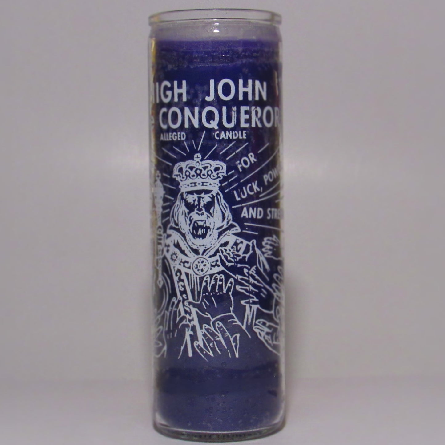 Purple candle with text and illustration in a glass container