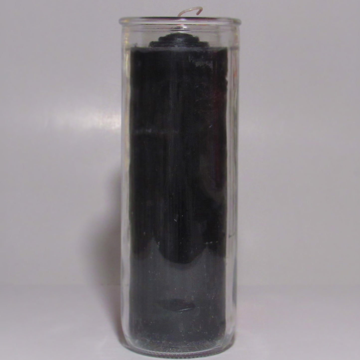 Removable Black wax candle in a clear glass container