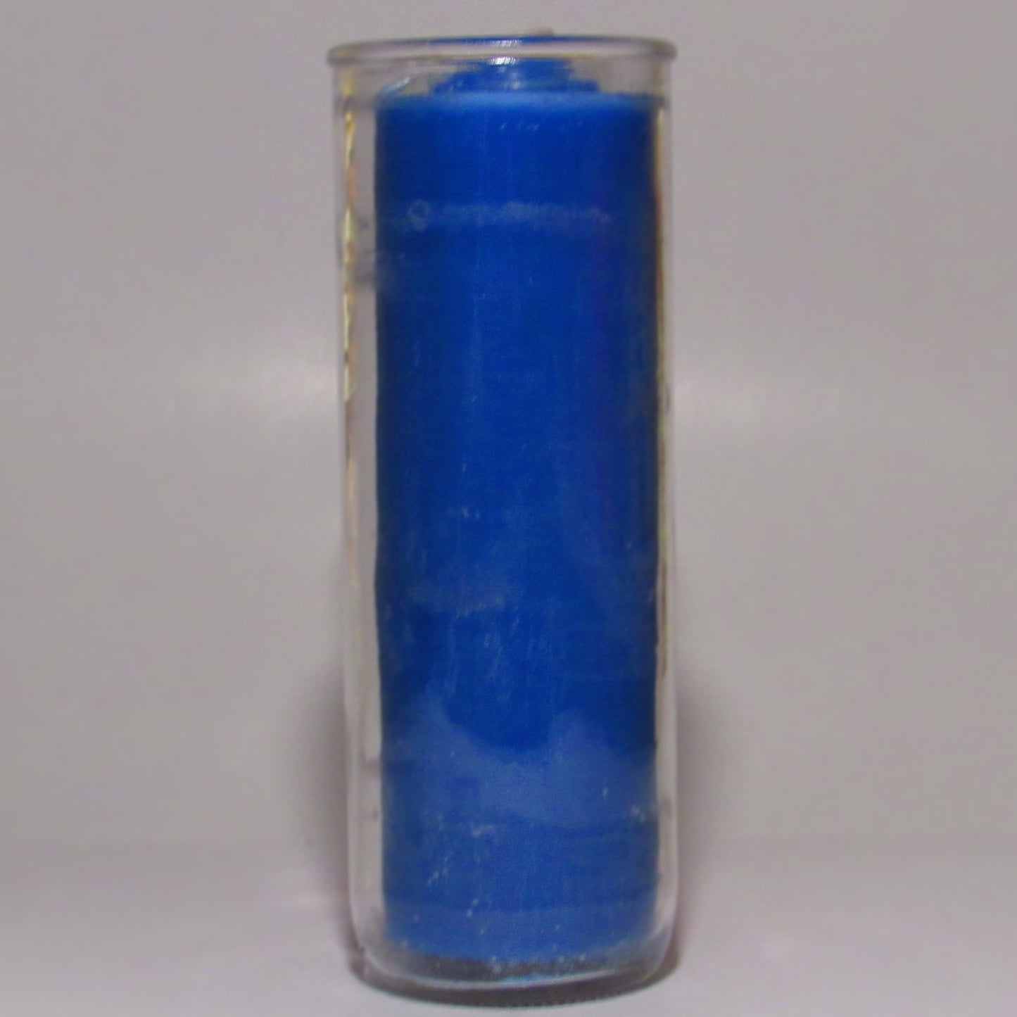 Removable Blue wax candle in a clear glass container
