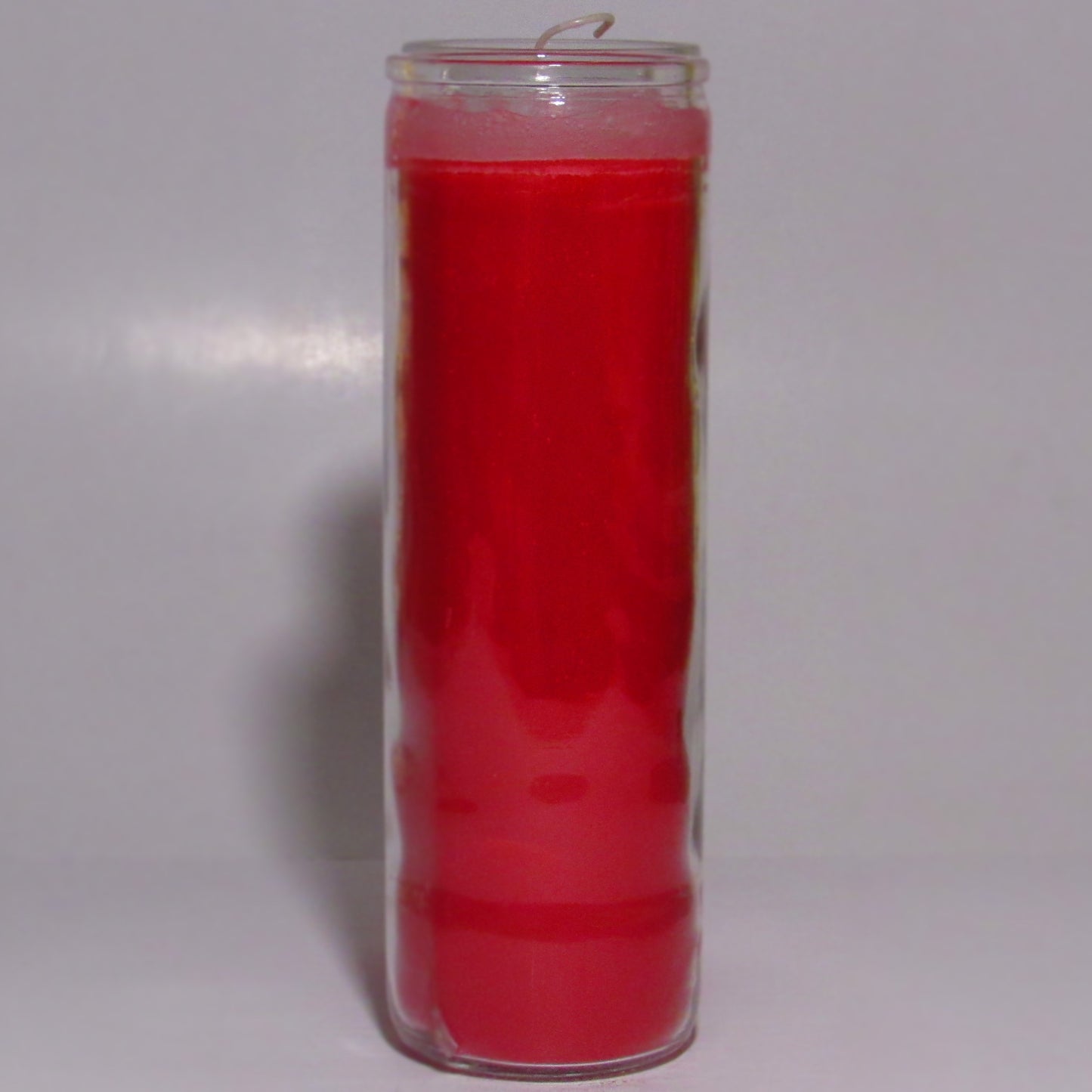 Red candle in a glass container