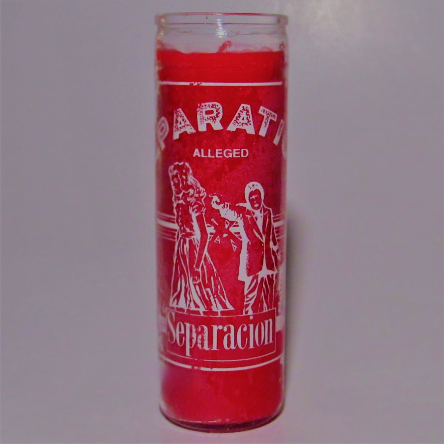Red candle with white text and graphics