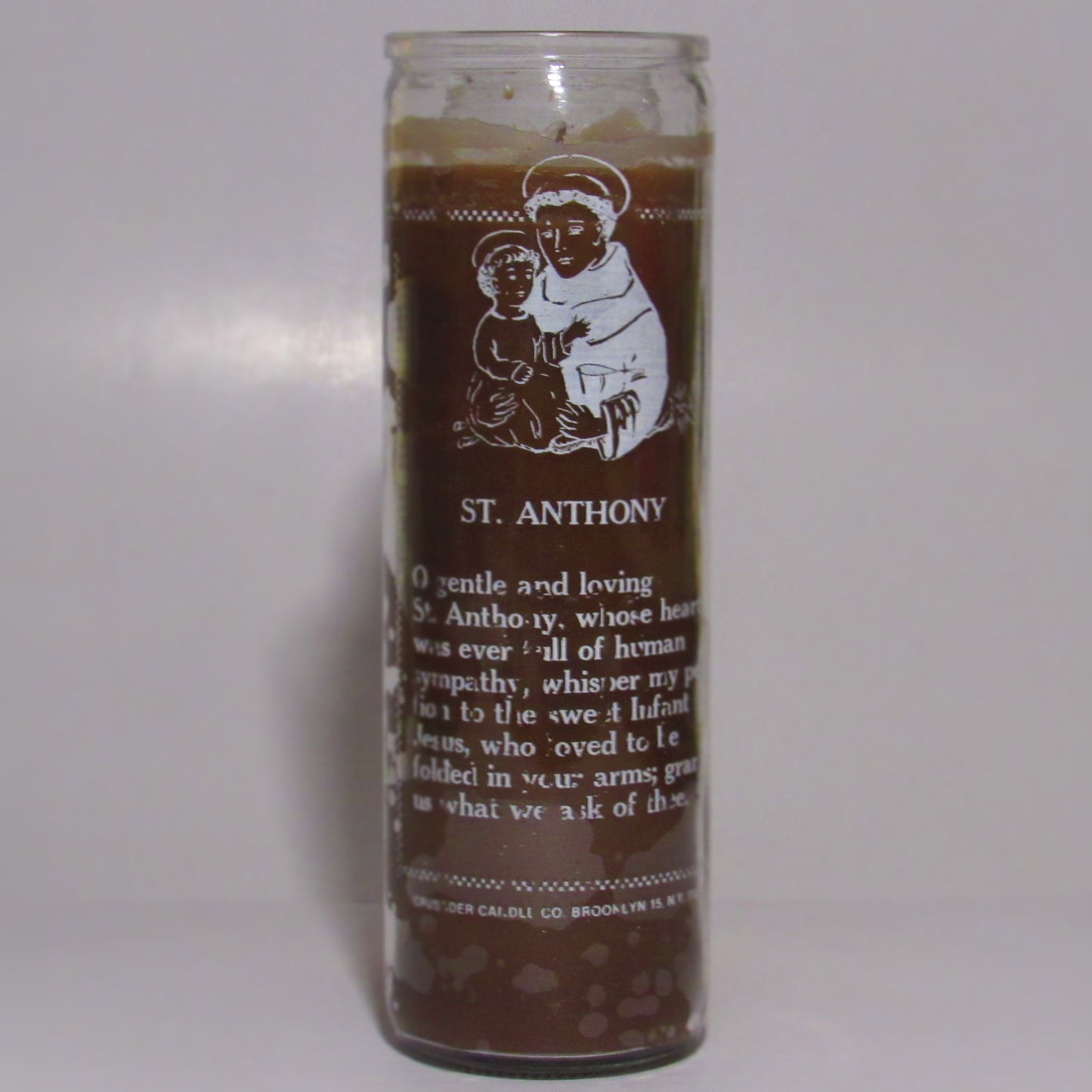 Candle with St. Anthony illustration and text