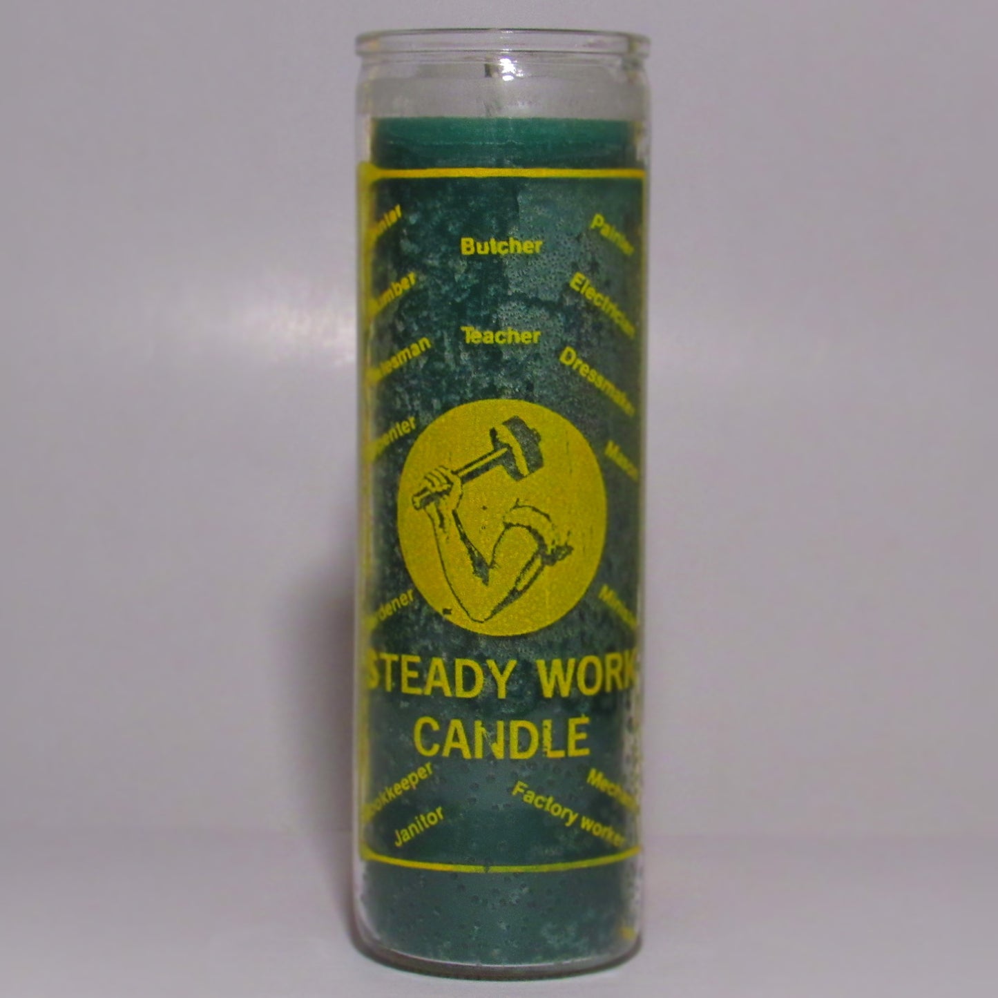 Green candle with yellow labe