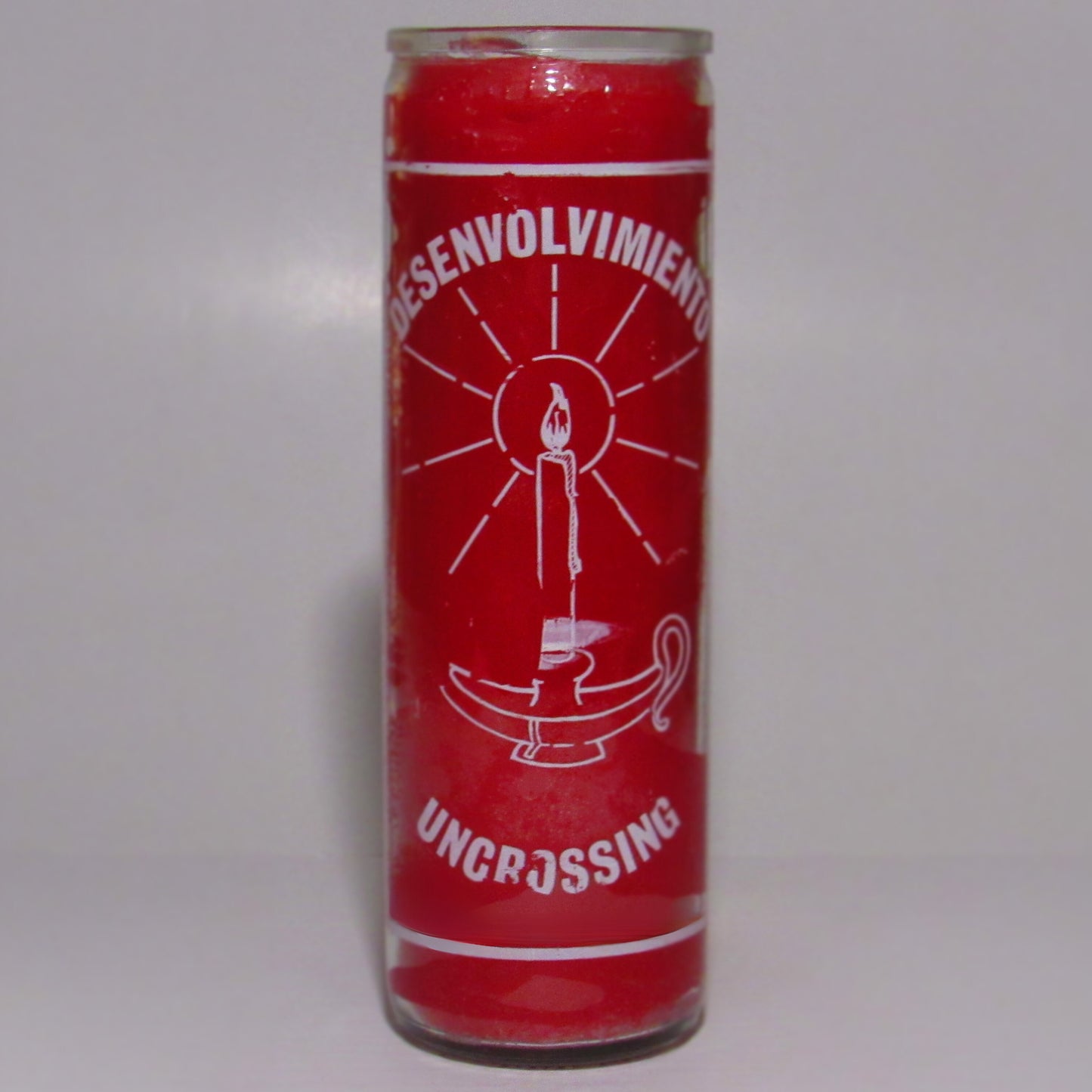Red candle with white graphics and text