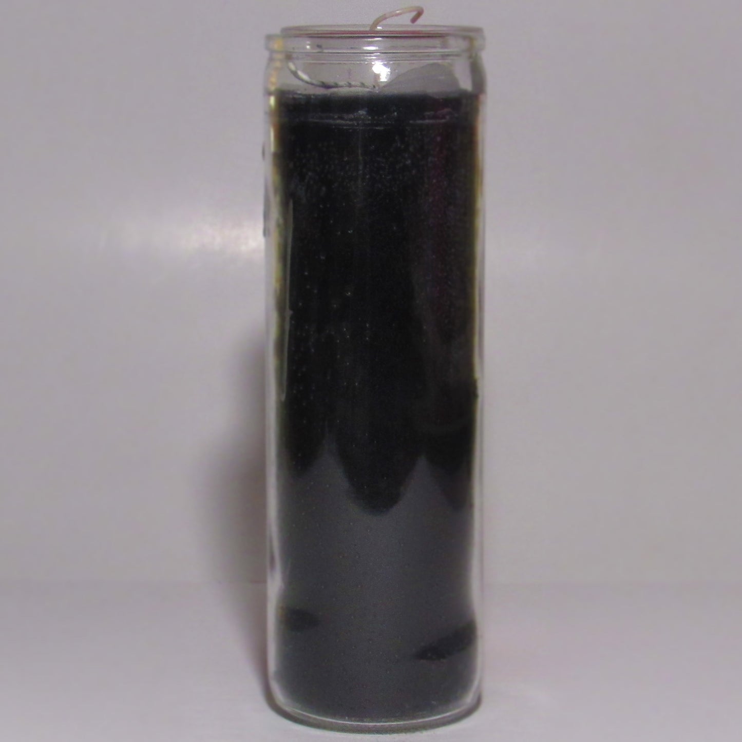 Black candle in a glass container