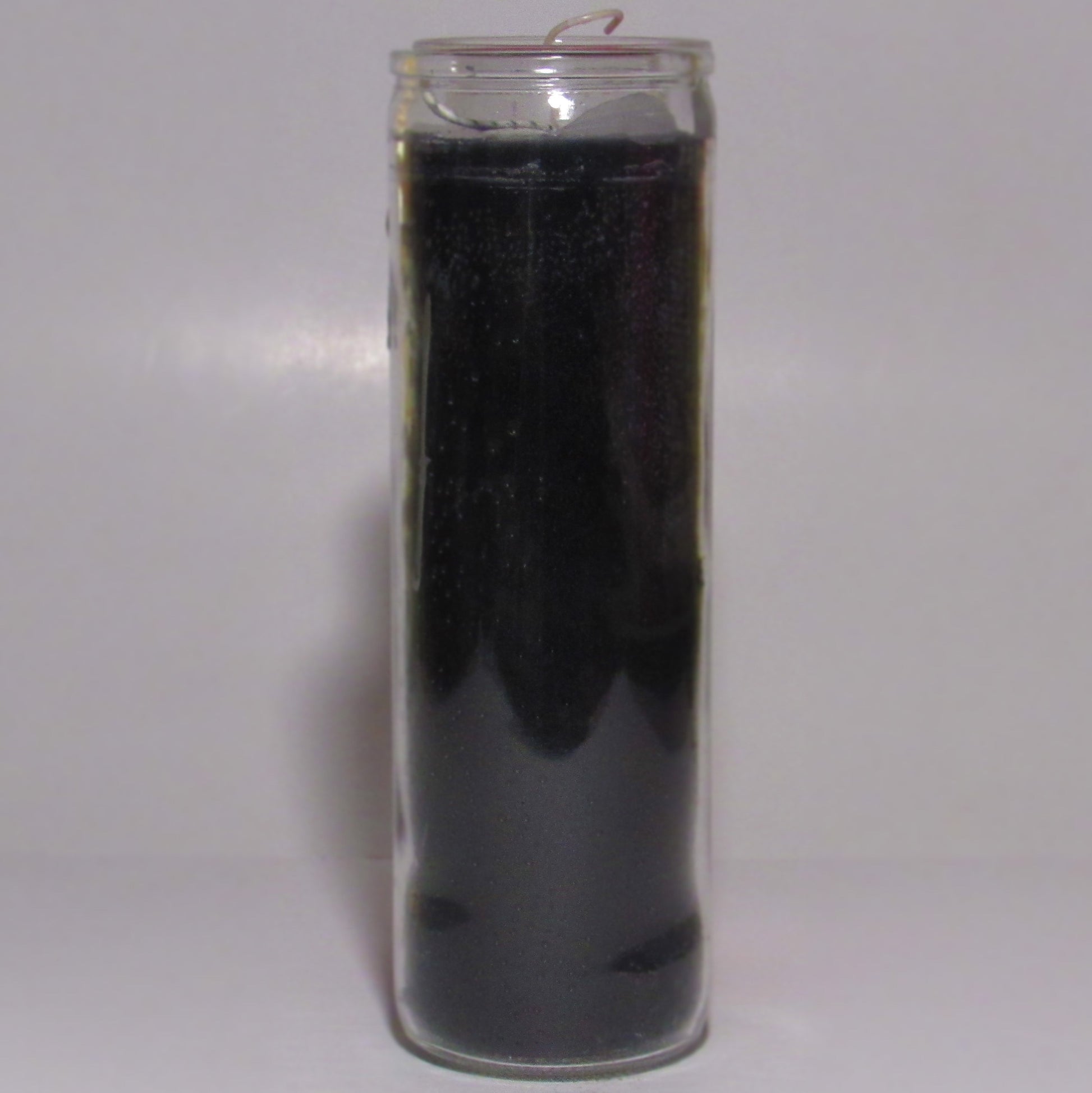 Black candle in a glass container