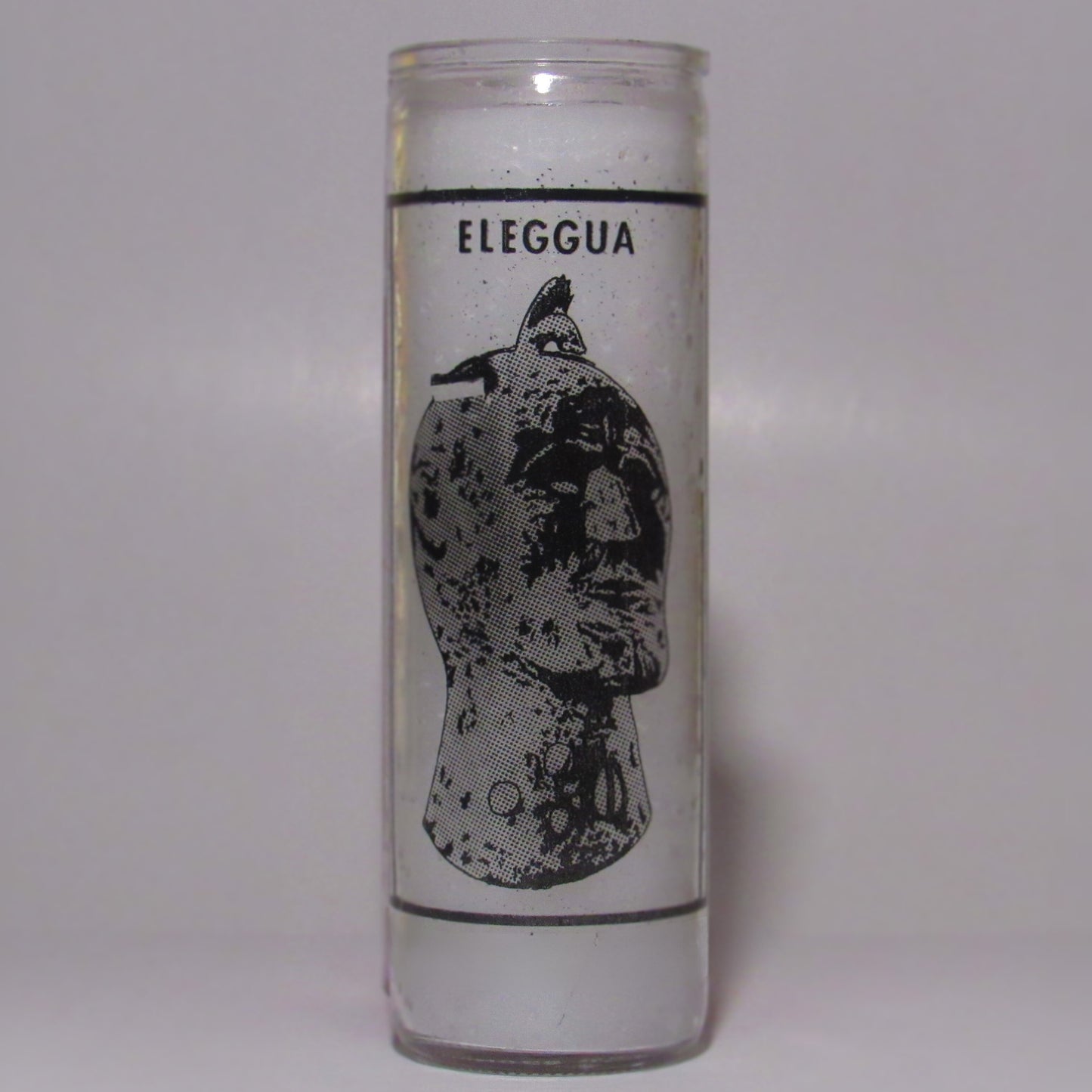 Candle with 'Eleggua' design 