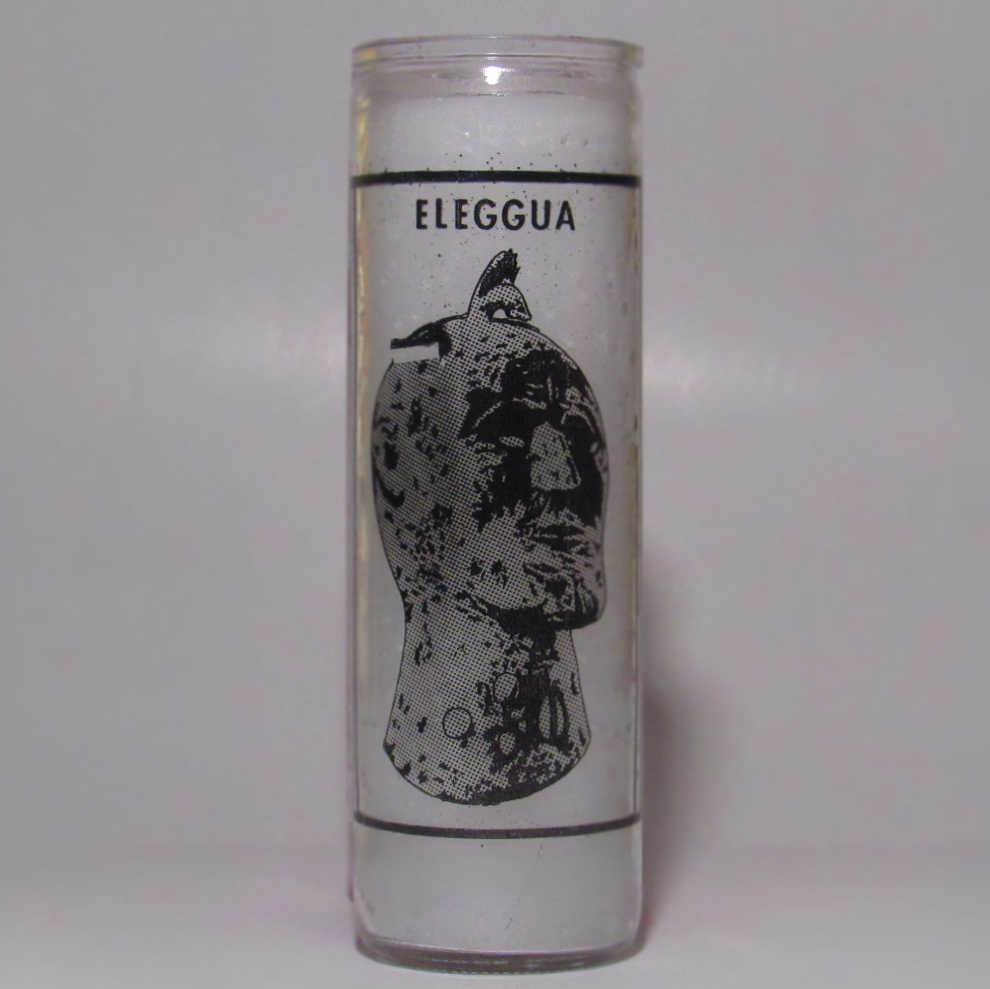 Candle with 'Eleggua' design 