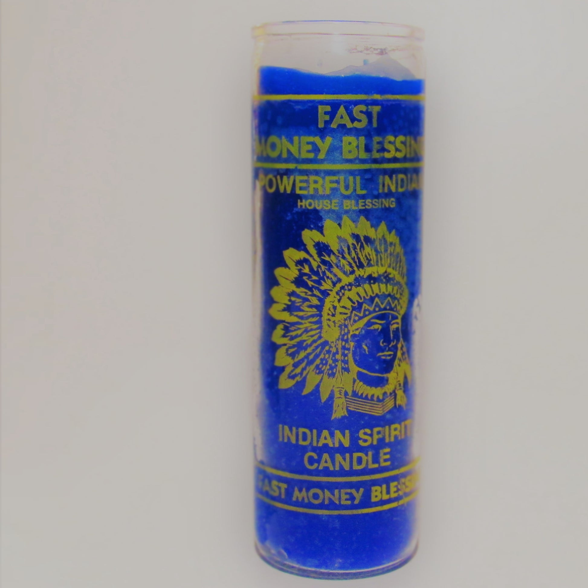 Blue candle with yellow text and an Indian headdress design 