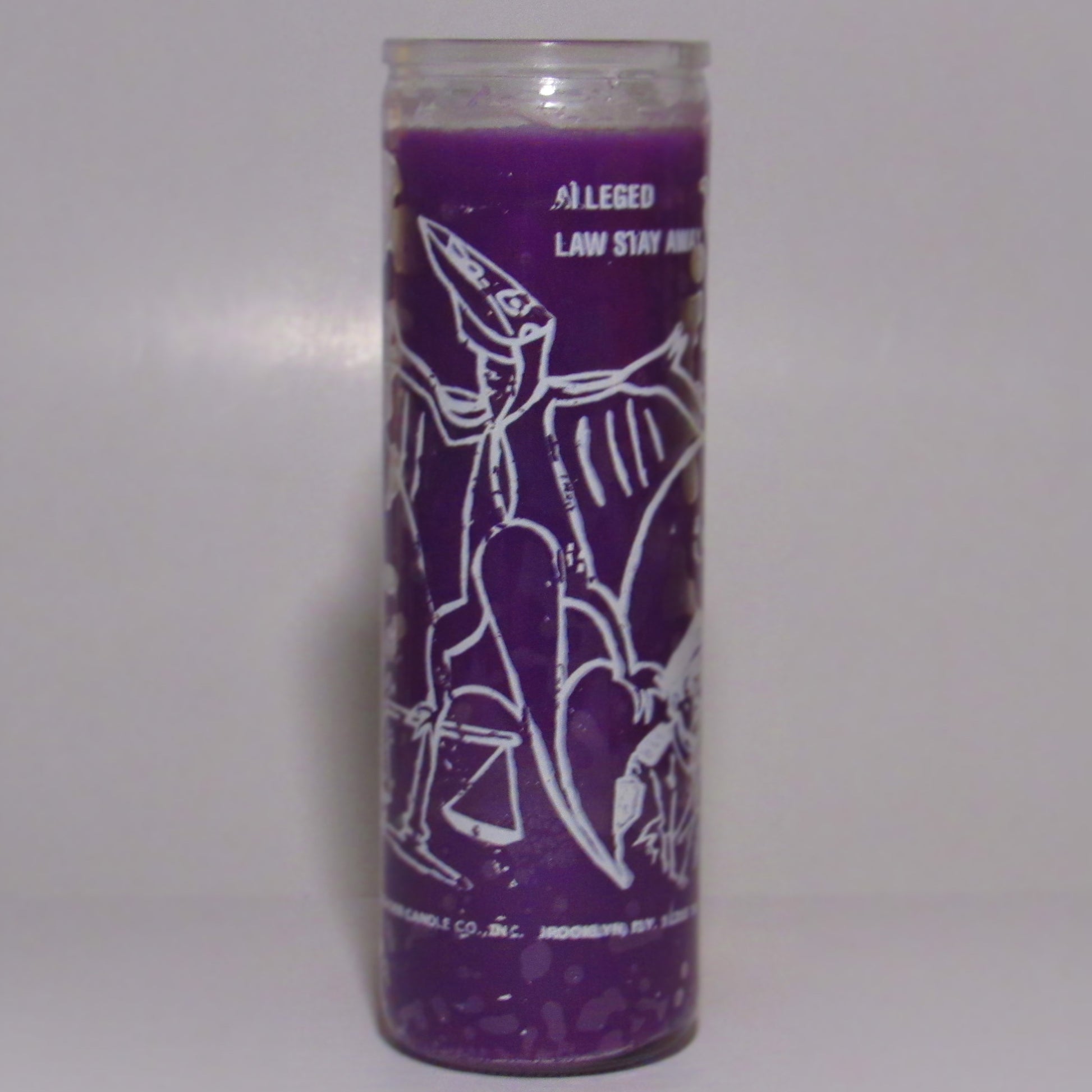 Purple candle with white graphics and text 
