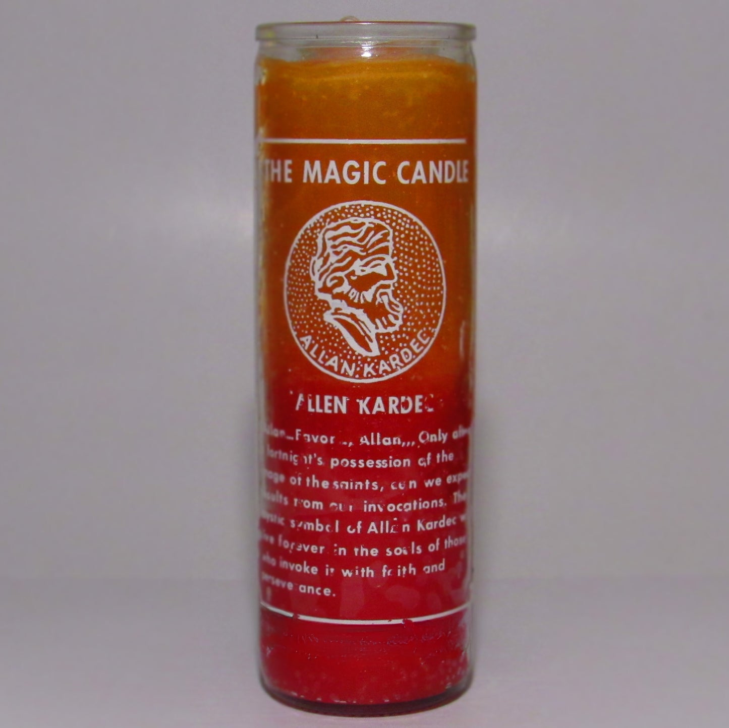 Candle with red label and text