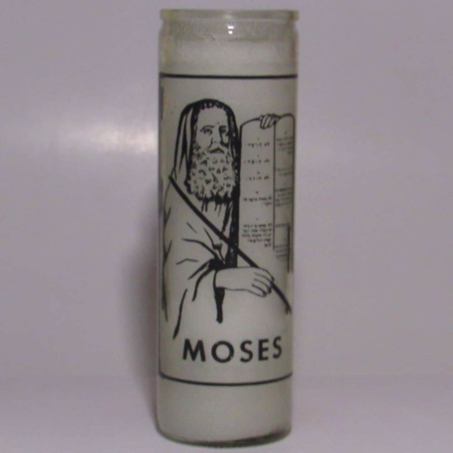 Candle with an illustration of Moses holding a tablet 