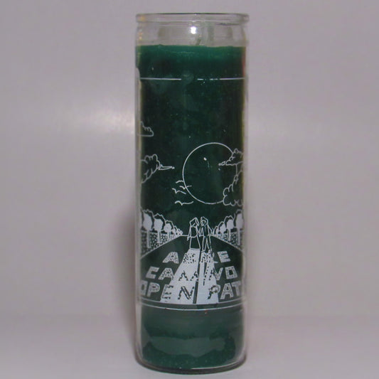 Green candle with white designs and text 