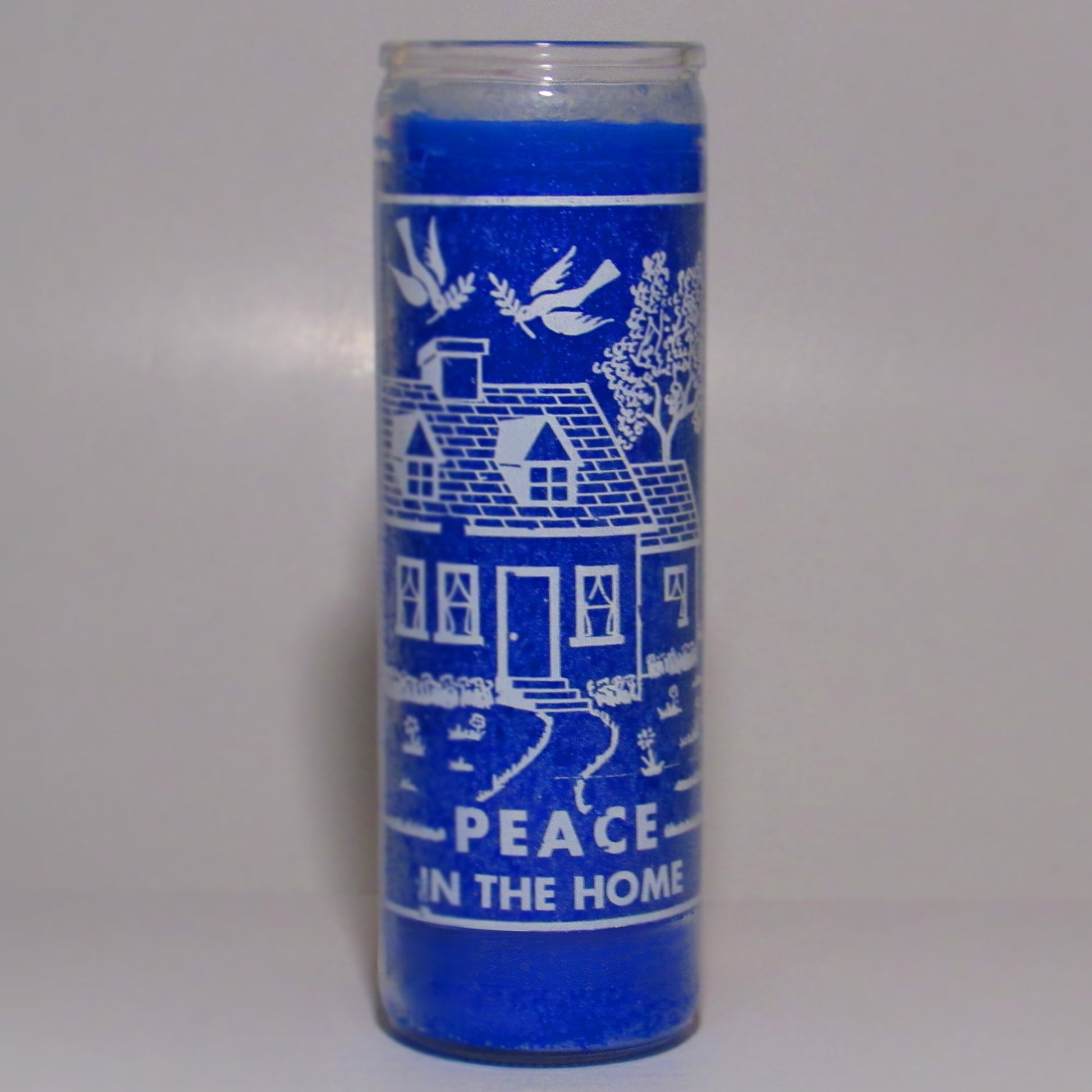 Blue candle with white designs and text 