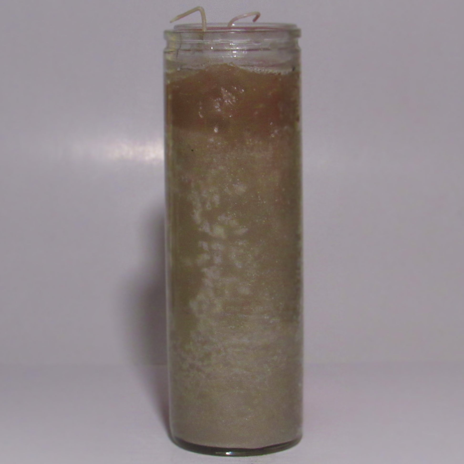 Tall grey glass candle with a textured surface 