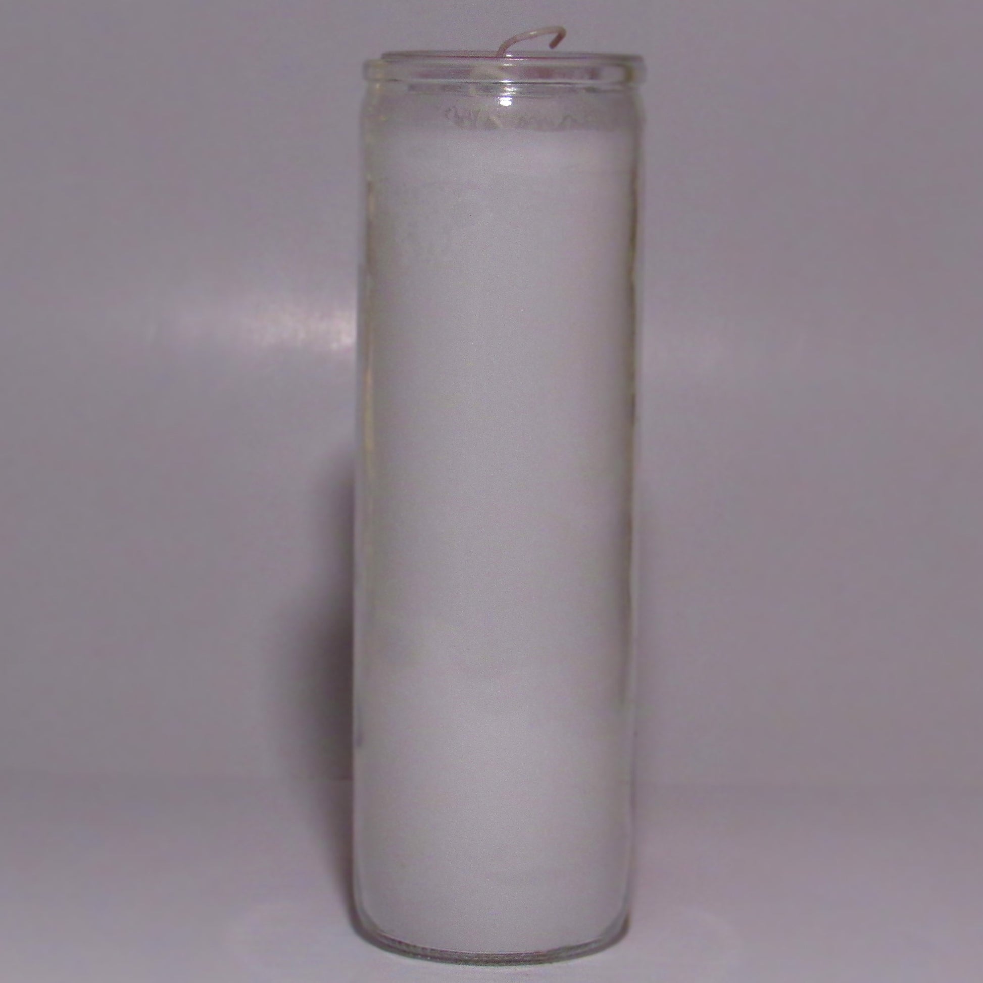 White candle in a glass holder 