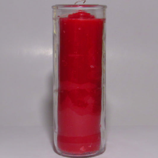 Red candle in a clear glass holder o