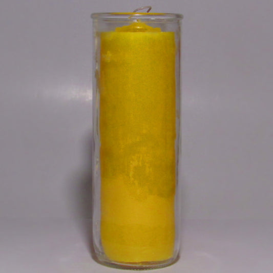 Yellow candle in a glass holder 