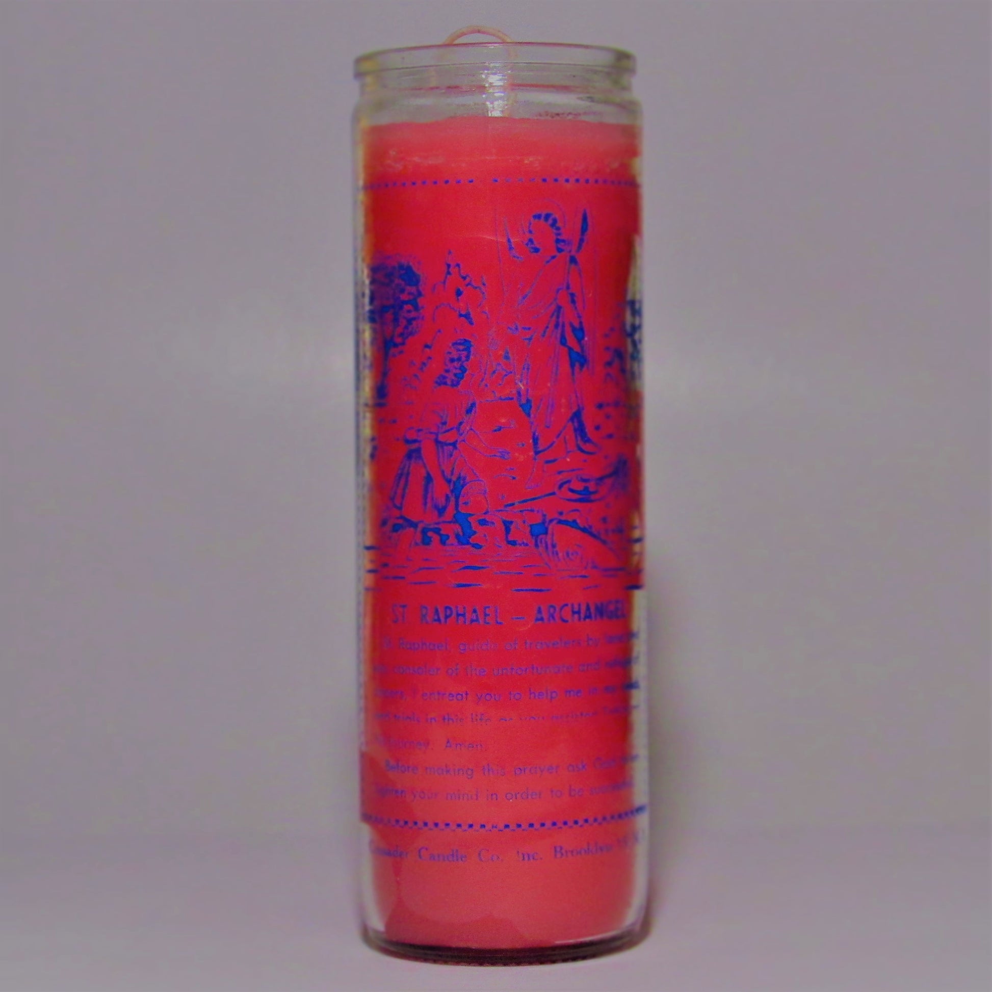 Pink candle with blue text and graphics 