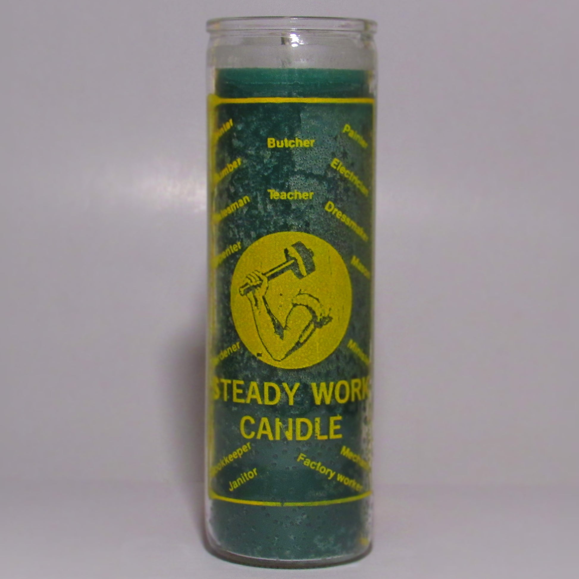 Green candle with yellow labe