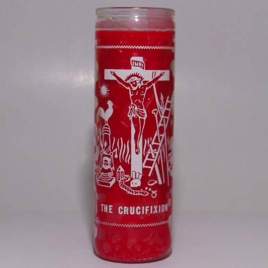 Red candle with white religious illustrations